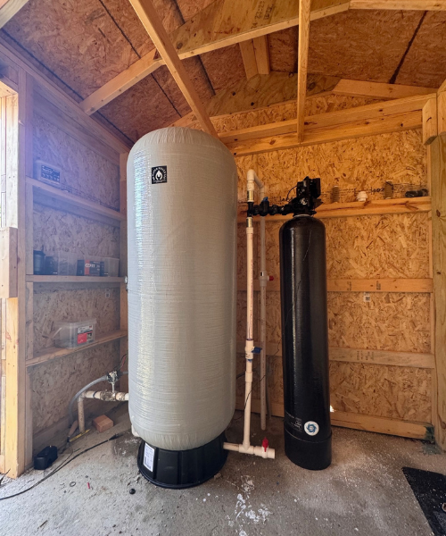 A large water heater sitting inside of a building