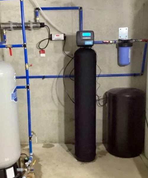 A water heater and a tank in a room